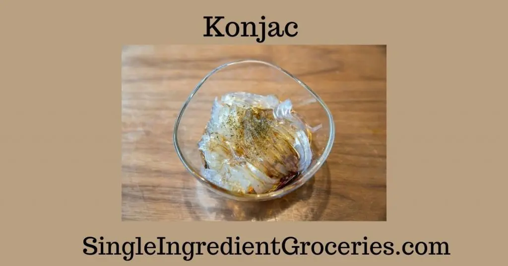 Konjac noodles in a glass bowl topped with seasoning and soy sauce for blog post about Konjac for Single Ingredient Groceries. 