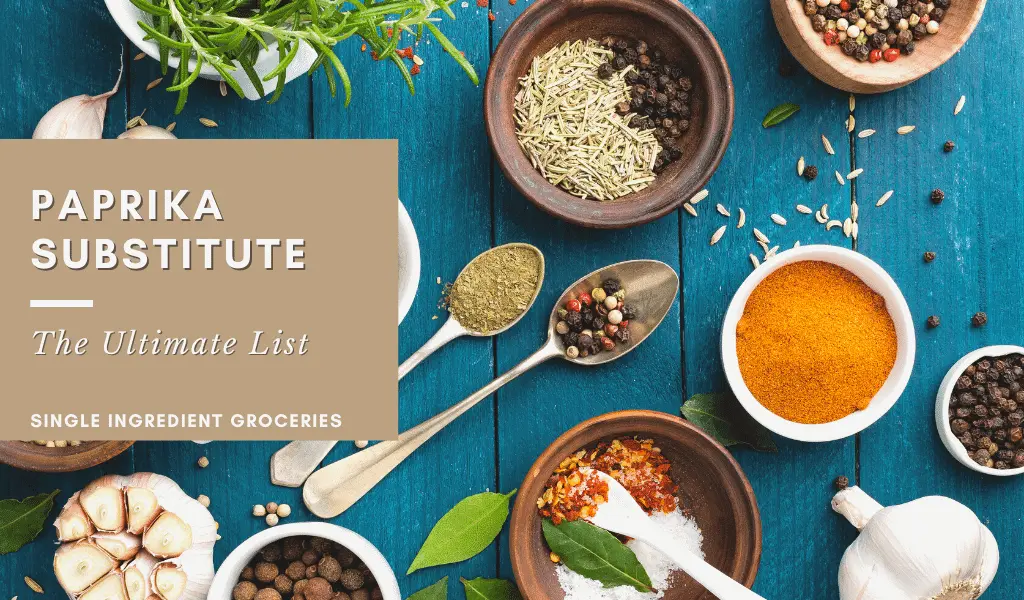 paprika substitute: the ultimate list blog banner with a variety of spices on a blue table.