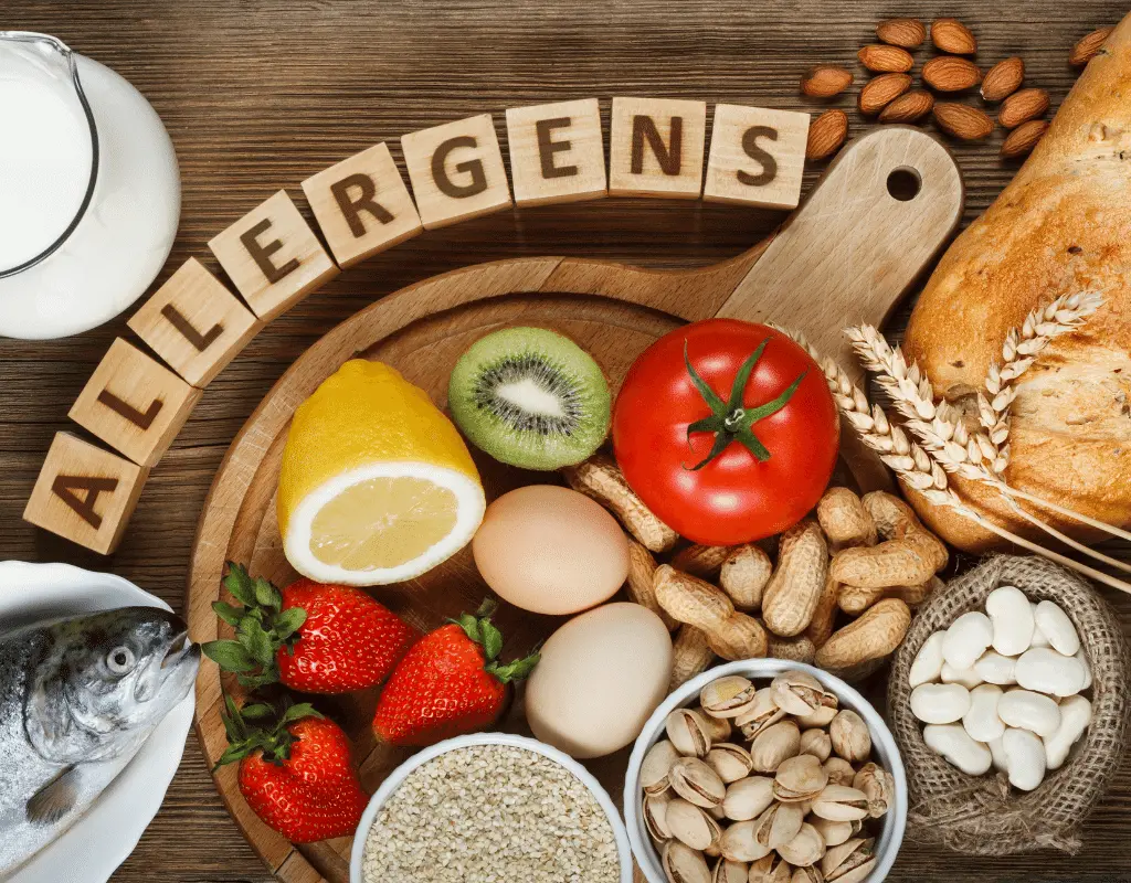 food allergy graphic with tomatoes, nuts, wheat, shellfish, beans strawberries
