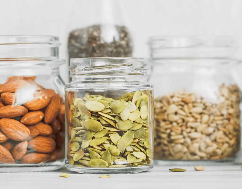 peanut alternatives in jars: almonds, pumpkin seeds, sunflower seeds