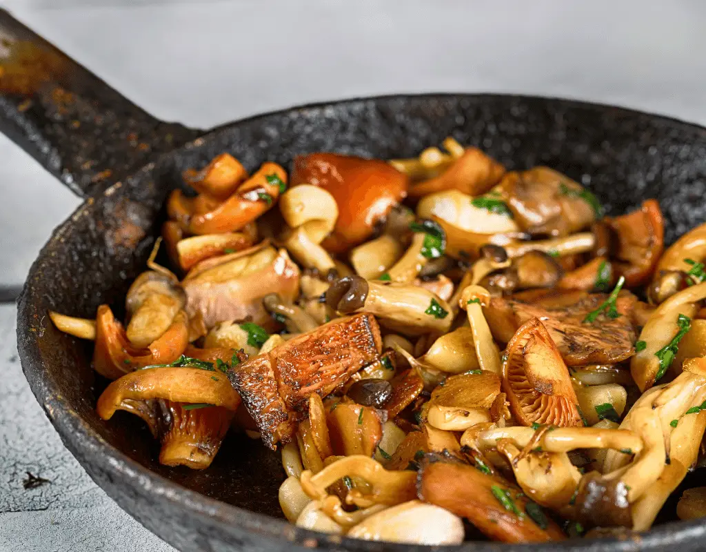 sauteed mushrooms in a cast iron skillet
