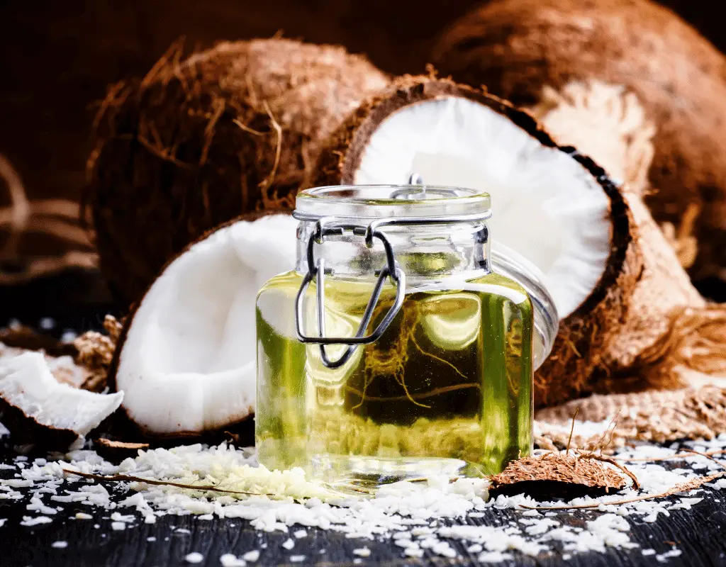 coconuts and coconut oil displayed on dark background