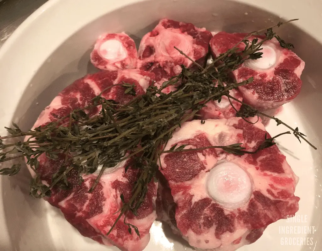 Jamaican oxtail recipe with herbs before cooking