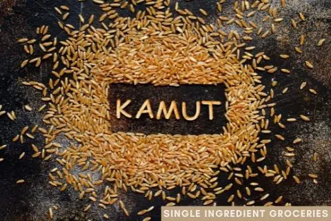 Kamut grain on a dark background with the word Kamut spelled out with grains; text at bottom of image is Single Ingredient Groceries; blog image for blog post about What is Kamut?