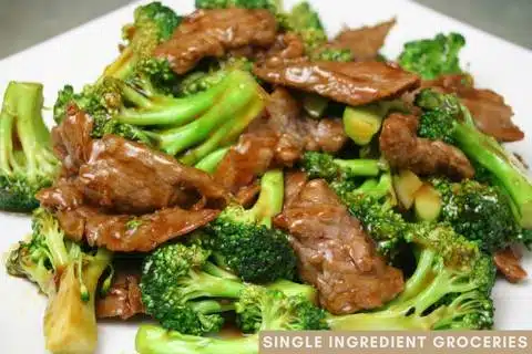 Beef and Broccoli meal on white dish for single ingredient groceries blog post about broccoli allergy. 
