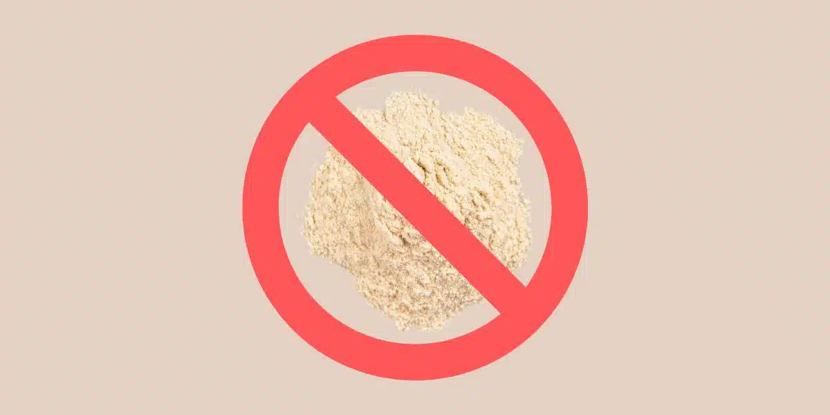 Photo of pectin powder with red prohibition "no" sign (circle with a line through it) on tan background for Single Ingredient Groceries blog about pectin allergy